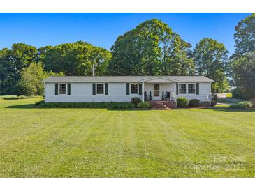 Charming single-story home with a well-maintained lawn, green shutters, and a welcoming porch at 105 Carrie Ln # 3, Cherryville, NC 28021