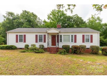 Charming single-story home with red shutters and a well-manicured front yard at 439 Kershaw Country Club Rd, Kershaw, SC 29067