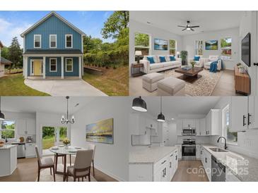 Charming two-story home with blue siding, white trim, and a bright yellow front door at 518 Herms Ave, Mount Holly, NC 28120