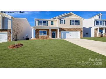 Charming two-story home with stone accents, a well-manicured lawn, and a welcoming front porch at 5536 Pamplona Way, Charlotte, NC 28214