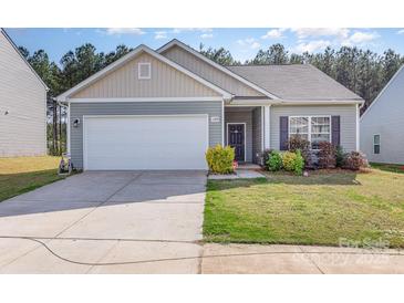 Charming single-story home with a well-manicured lawn and attached two-car garage, perfect for suburban living at 1109 Culver Spring Way, Charlotte, NC 28215