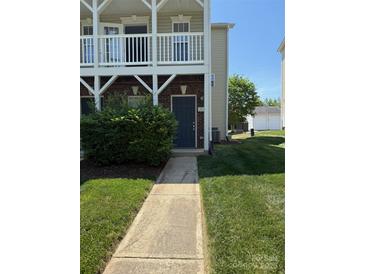 Charming townhouse with a private entrance and a well-maintained lawn at 118 Steam Engine Dr # 201, Mooresville, NC 28115