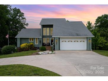 Charming two-story home with a two-car garage and mature landscaping at 3005 Vernell Ln, Shelby, NC 28150