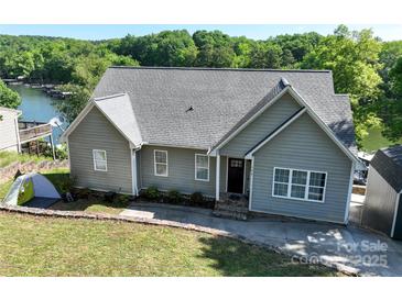 Charming single-Gathering home with well-maintained lawn and proximity to the lake at 126 Strand Rd, New London, NC 28127