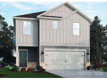 Charming two-story home featuring a two-car garage and light gray vertical siding at 1420 Wildflower St, Newton, NC 28658