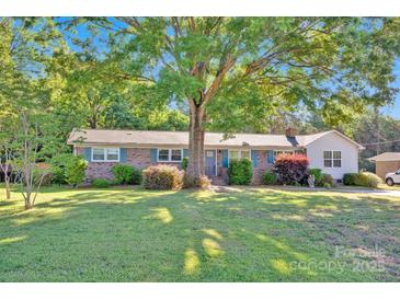 Charming brick ranch with a large front yard and a mature shade tree in a peaceful neighborhood at 1924 Lakeview Dr, Rock Hill, SC 29732