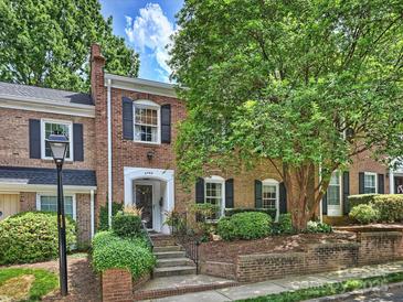 Charming brick townhome with lush landscaping and a welcoming entrance at 4464 Mullens Ford Rd, Charlotte, NC 28226