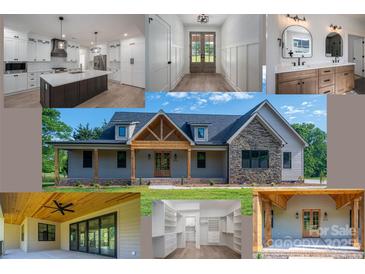 Beautiful home exterior featuring stone accents, wood columns, covered porch, and landscaped yard at 2313 Ivey Church Rd, Maiden, NC 28650