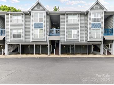 Charming condo building with well-maintained landscaping and convenient parking at 517 N Graham St # 3E, Charlotte, NC 28202