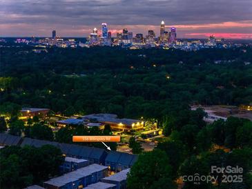 Night aerial view of the townhomes with the Charlotte skyline in the background during sunset at 556 Billingsley Rd, Charlotte, NC 28211