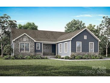 Charming single-story home with stone accents, blue siding, and a well-manicured front yard at 1628 Dresden Dr, Rock Hill, SC 29732