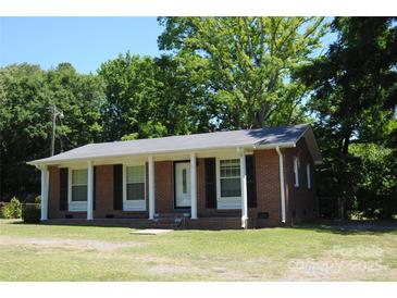 Charming brick home with a columned front porch and black shutters at 288 S Sutton Rd, Fort Mill, SC 29708