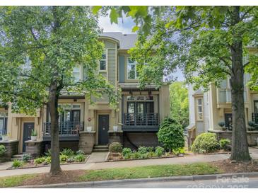 Charming townhome with beautiful landscaping and covered balcony at 738 Garden District Dr, Charlotte, NC 28202