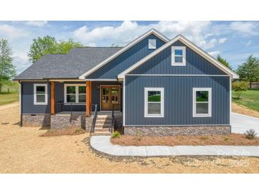 Beautiful, new construction home featuring navy blue siding and a brick foundation at 115 Falling Creek Dr, Statesville, NC 28625
