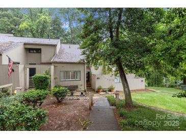 Charming townhome with mature trees and landscaping creates a serene setting and inviting curb appeal at 222 Riverview Ter, Clover, SC 29710