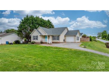 Charming single-Gathering home featuring a well-manicured lawn and inviting curb appeal at 5052 Swinging Bridge Rd, Conover, NC 28613