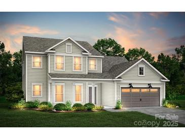 Charming two-story home with well-maintained landscaping and attached two-car garage at 13940 Penbury Ln # 402, Charlotte, NC 28278