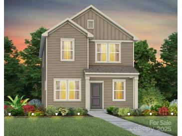 Charming two-story home featuring neutral siding, manicured landscaping, and a welcoming entrance at 14028 Parkside Crossing Dr # 331, Charlotte, NC 28273