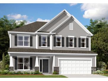 Charming two-story home featuring a two-car garage, classic shutters and lovely curb appeal at 9920 Emerson Glen Dr, Kannapolis, NC 28027