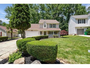Charming two-story home with a well-manicured lawn and lovely front porch at 6640 Autumn Gate Ln, Charlotte, NC 28216