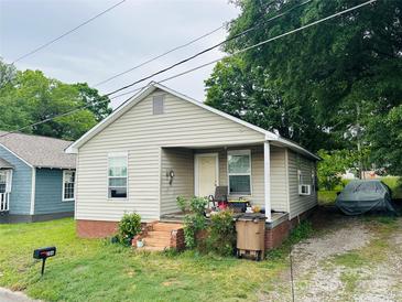 Charming single-story home featuring a cozy front porch and well-maintained lawn at 206 Royster Ave, Shelby, NC 28150