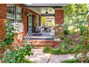 Charming front porch with brick columns and comfortable seating, perfect for relaxing outdoors at 510 Wiley Ave, Salisbury, NC 28144