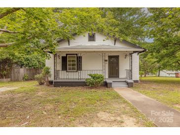 Charming home featuring a covered front porch, black trim, and landscaped yard at 10 Bolt Dr, Shelby, NC 28150