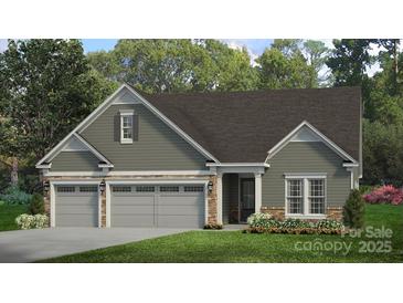 Charming single-Gathering home with a three car garage and stone accents at 13241 Cozy Ct, Charlotte, NC 28215