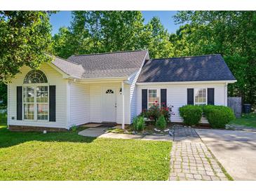 Charming one-story home with white siding, black shutters, and a well-manicured lawn and garden at 2432 Barkers Ridge Dr, Bessemer City, NC 28016