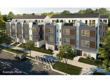 Modern townhome exterior showcasing a rooftop deck and contemporary architectural details at 3009 Loso Ter # 58, Charlotte, NC 28217