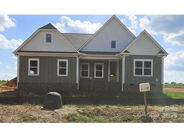Charming craftsman style home with mixed siding and brick accents and covered entryway at Lot 101 Coppergate Dr, Salisbury, NC 28147