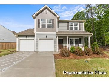Charming two-story home featuring a welcoming front porch, two-car garage, and well-maintained lawn at 165 Clove Hitch Dr # I281, Statesville, NC 28677