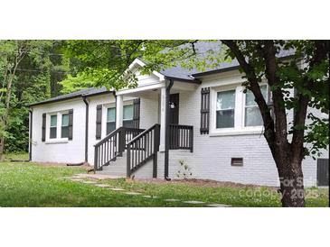 Charming, newly renovated single-story home with a white brick exterior and well-maintained front yard at 2376 S Us 321 Hwy, Newton, NC 28658