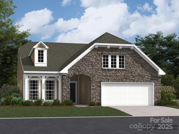 Charming home featuring a stone facade, dormer window, and attached two car garage at 6274 Fairfax Ct, Maiden, NC 28650
