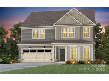 Charming two-story home with a craftsman-style exterior and an attached two-car garage at 15020 Meadows Hunt Ln # 159, Huntersville, NC 28078