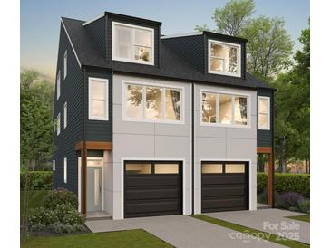 Modern townhouse with black garage doors, white siding, and large windows; an inviting two-story facade at 2430 Arty Ave # 5B, Charlotte, NC 28208
