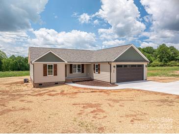 Charming single-story home with a two-car garage, lovely siding, and a well-manicured lawn at 355 Northbrook Iii School Rd # 10, Vale, NC 28164