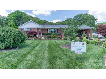 Charming brick home with beautifully landscaped front yard and manicured lawn at 3008 Imperial Dr, Gastonia, NC 28054