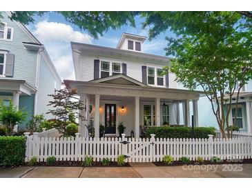 Charming white two-story home featuring a welcoming front porch and a picket fence at 330 Horton Grove Rd, Fort Mill, SC 29715