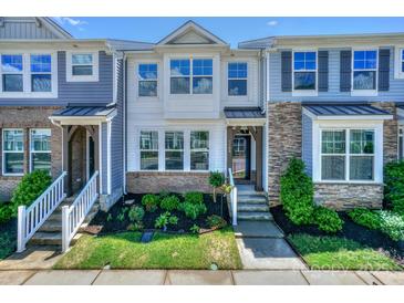 Charming townhome with landscaped front yard and inviting entrance at 110 Synandra Dr # B, Mooresville, NC 28117