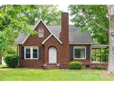 Charming brick home featuring a gabled roof, black shutters, and a cozy front porch at 4098 S Nc Hwy 127 Hwy, Hickory, NC 28602