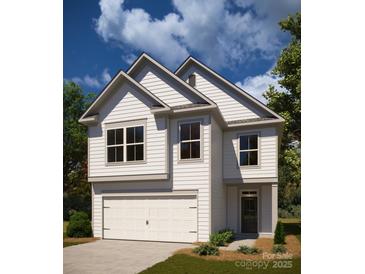 Charming two-story home featuring classic white siding and a welcoming two-car garage at 12744 Susanna Dr, Charlotte, NC 28214