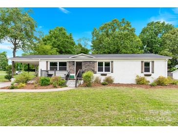 Charming single story home boasts a well-manicured lawn and covered front porch at 1501 E Church St, Cherryville, NC 28021