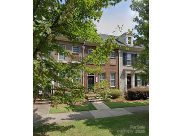 Charming brick townhome with a well-maintained front yard and inviting entryway at 2485 Shanklin Ln, Denver, NC 28037