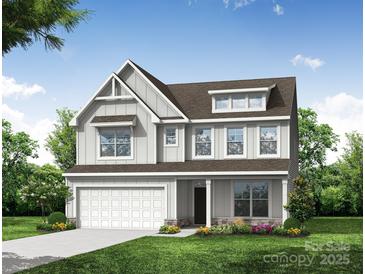 Charming two-story home featuring stone accents, a covered front porch, and an attached two-car garage at 8619 Frank Grier Rd # 3, Charlotte, NC 28215