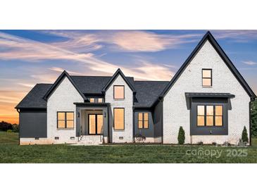 Beautiful two story home with modern black trim accents and professionally landscaped yard at 1141 Harper Lee Dr, Newton, NC 28658