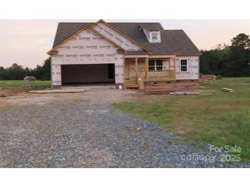 New construction home with an attached 2-car garage and materials in place for further construction at 145 Mason Tanner Ct, Rock Hill, SC 29730