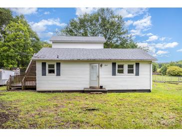 Charming single story home with a covered porch and black shutters on a lush green lawn at 2317 Flint Hill Church Rd, Shelby, NC 28152