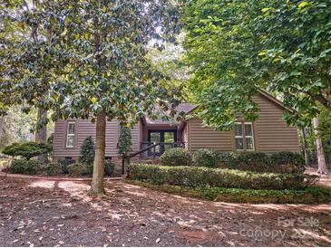 Charming home featuring mature trees and manicured landscaping at 46 Timberidge Dr, Lake Wylie, SC 29710