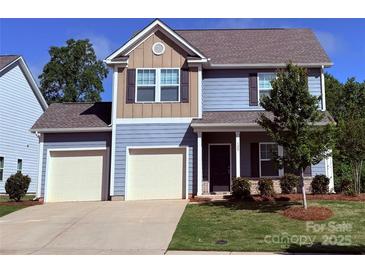 Charming two-story home with a two car garage and manicured lawn at 129 Canada Dr # 85, Statesville, NC 28166